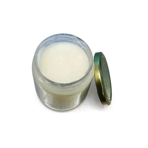 Top view of an open Nativus Farms A2 Buffalo Desi Ghee glass jar with brass lid alongside, displaying rich white ghee prepared in Rann of Kutch